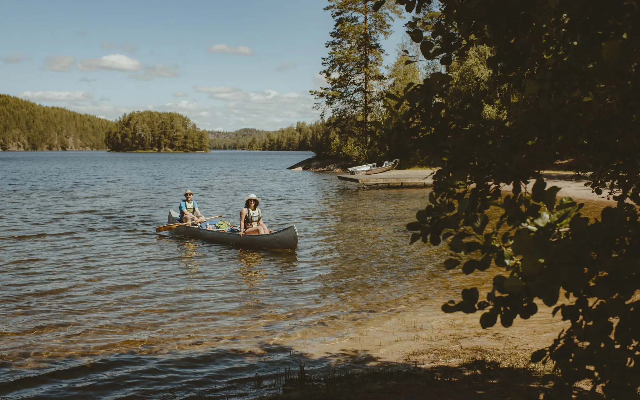 two people canoeing on a lake in Sweden